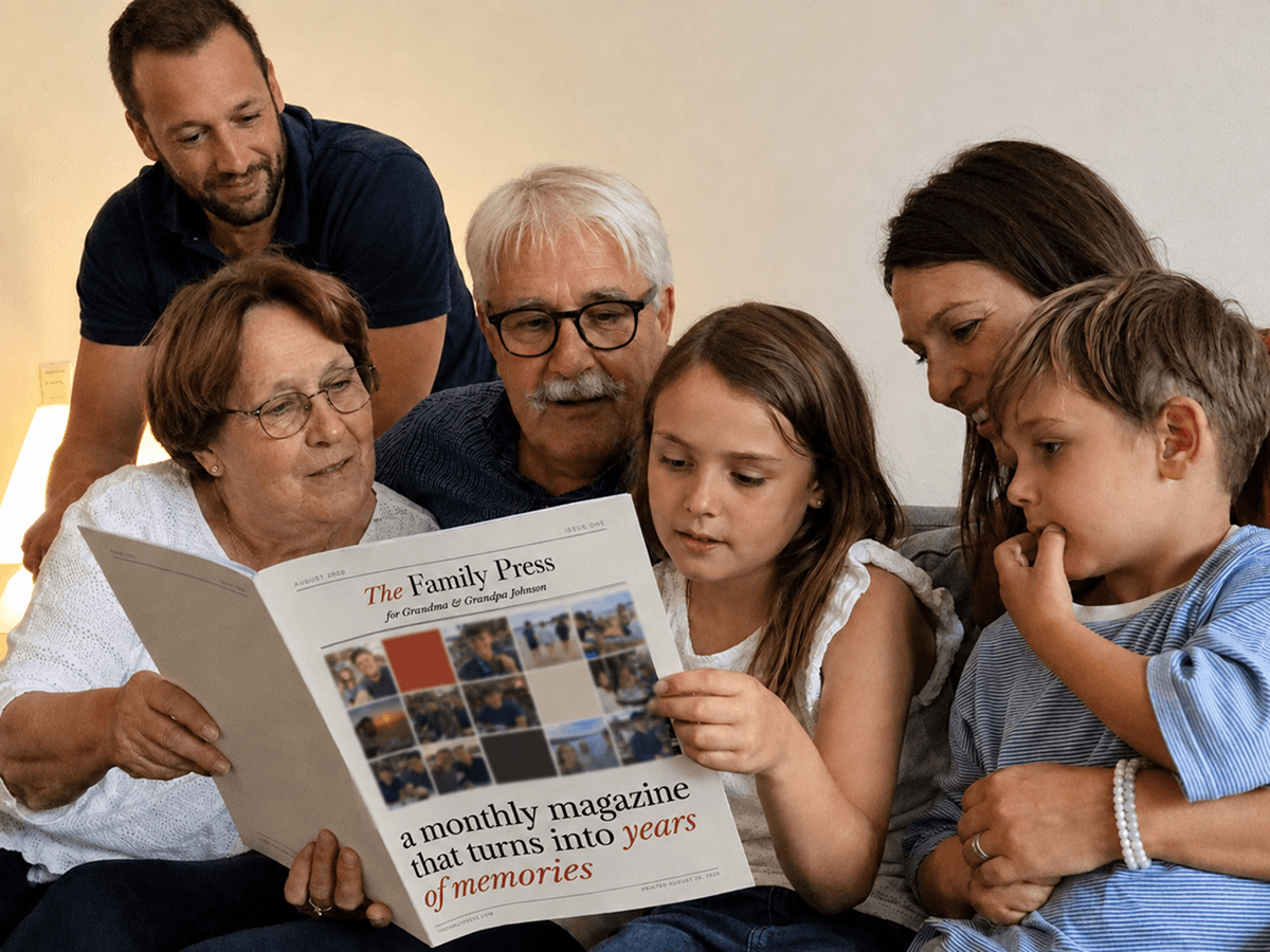 Grandparents looking through The Family Press with their children and grandchildren